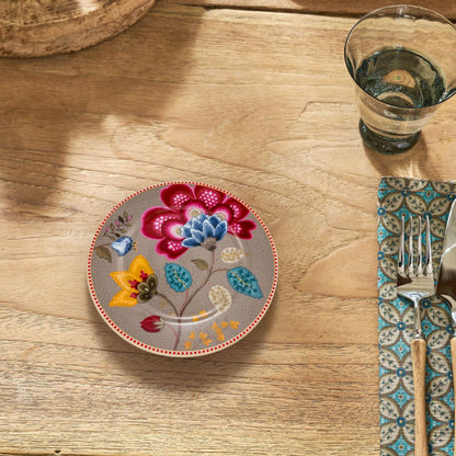 gebaksbord beige met bloemen op tafel