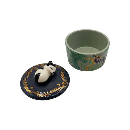 Deksel met 3 D kat naast het voorraadpotje